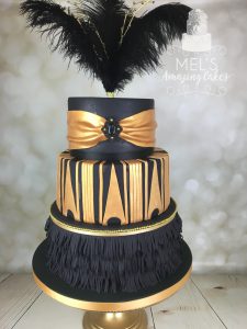 Black fringing with gold details wedding cake
